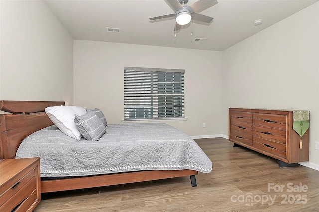 bedroom featuring wood-type flooring and ceiling fan