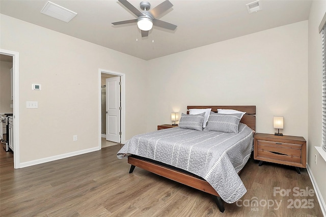 bedroom with hardwood / wood-style floors and ceiling fan