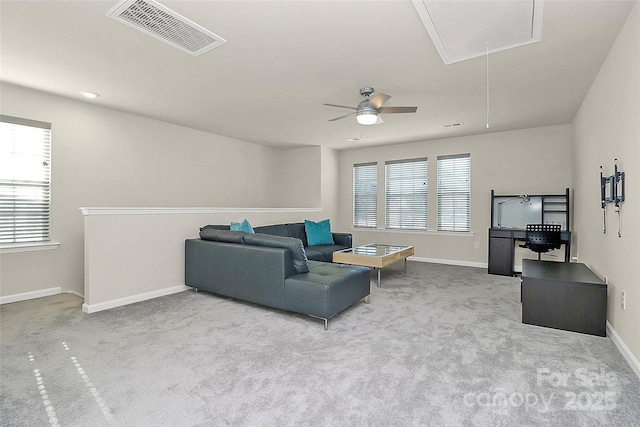 living room featuring ceiling fan and carpet