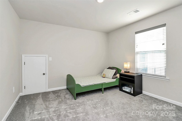 bedroom with light colored carpet