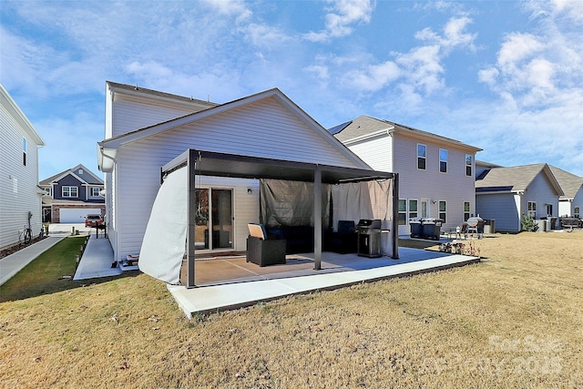 back of property featuring a yard and a patio area