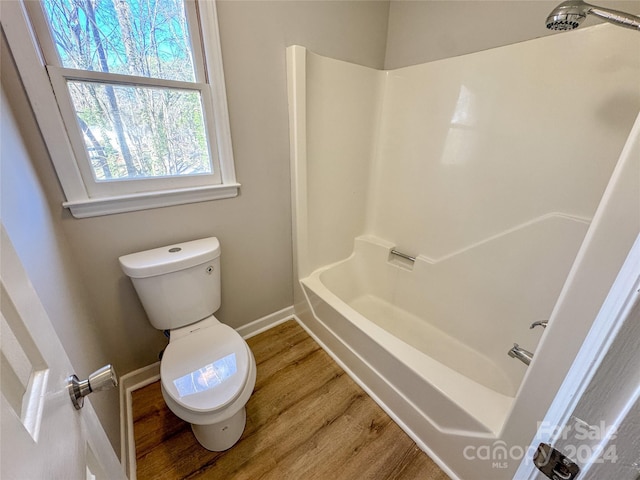 bathroom featuring hardwood / wood-style floors and toilet