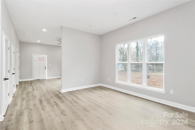 spare room featuring light wood-type flooring