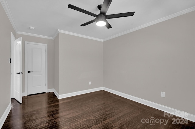 empty room featuring ceiling fan, dark hardwood / wood-style floors, and ornamental molding