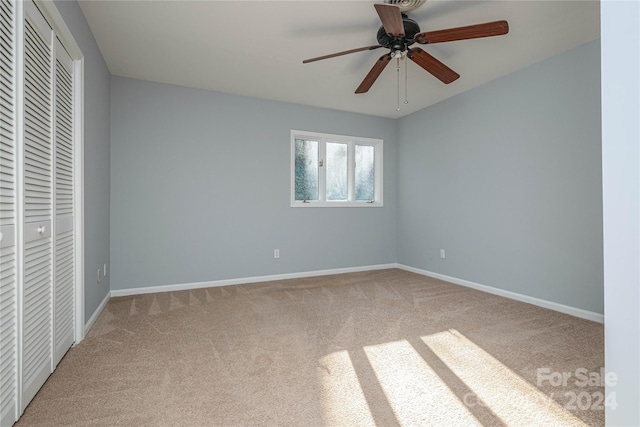 unfurnished bedroom featuring carpet flooring and ceiling fan