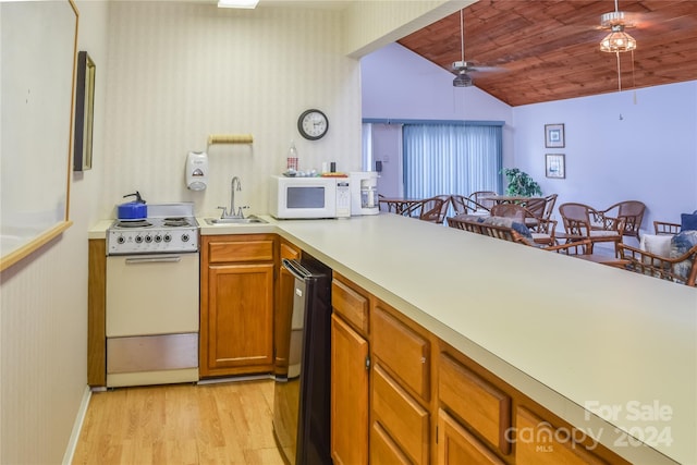 kitchen featuring light wood-type flooring, white appliances, vaulted ceiling, sink, and wooden ceiling