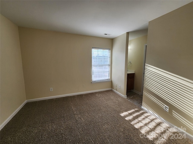 empty room featuring carpet floors