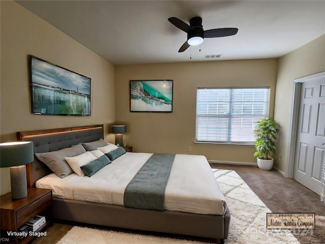 bedroom with ceiling fan and carpet floors