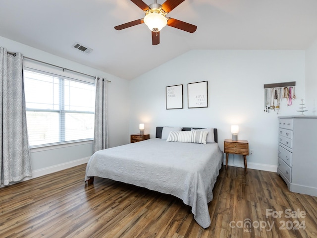 bedroom with vaulted ceiling, ceiling fan, and dark hardwood / wood-style floors