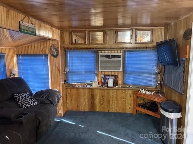 interior space featuring a wall mounted air conditioner, wood ceiling, and wooden walls