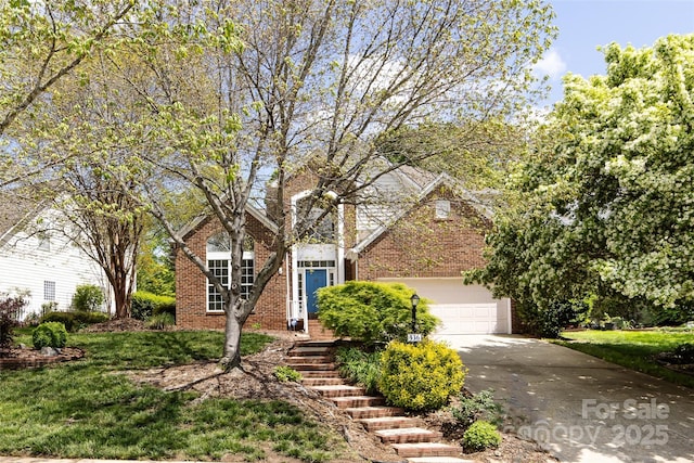 view of front facade featuring brick siding, a front yard, a garage, and driveway
