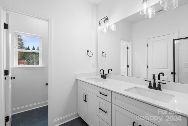 bathroom with tile patterned floors and vanity