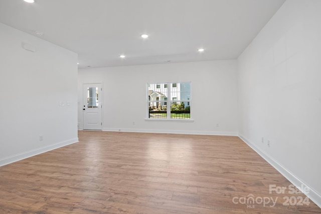 spare room with light hardwood / wood-style flooring