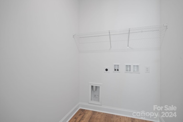 laundry room featuring hardwood / wood-style floors, hookup for an electric dryer, and hookup for a washing machine