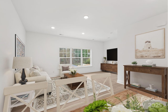 living room with light hardwood / wood-style flooring