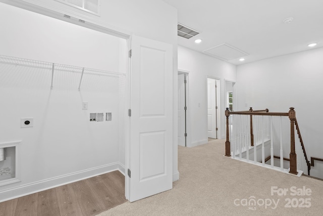 washroom featuring light wood-type flooring, hookup for a washing machine, and electric dryer hookup