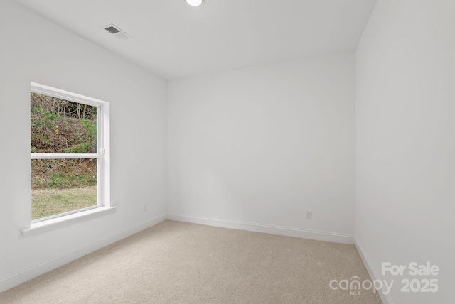 unfurnished room featuring carpet flooring