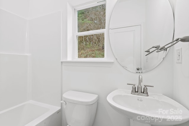 bathroom featuring sink and toilet