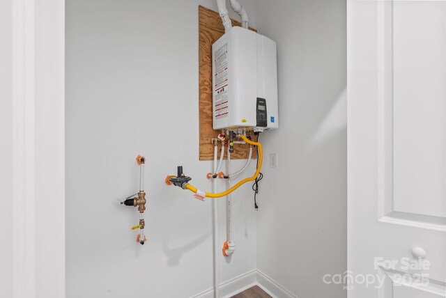 utility room with water heater