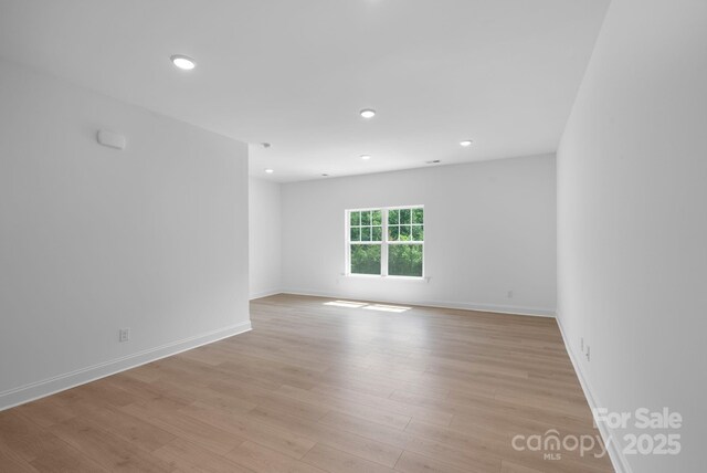 190 Cherry Springs Ln Unit 1-E, Asheville, NC 28804 - empty room featuring light wood-type flooring, baseboards, and recessed lighting
