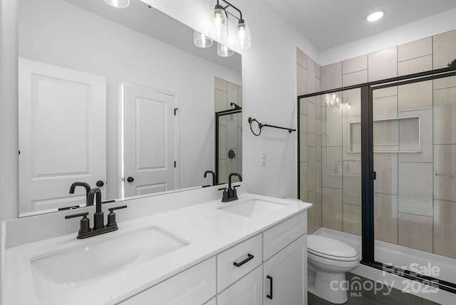 190 Cherry Springs Ln Unit 1-E, Asheville, NC 28804 - bathroom featuring a shower stall, toilet, double vanity, and recessed lighting