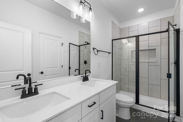 190 Cherry Springs Ln Unit 1-E, Asheville, NC 28804 - bathroom with toilet, a shower stall, double vanity, recessed lighting, and tile patterned flooring