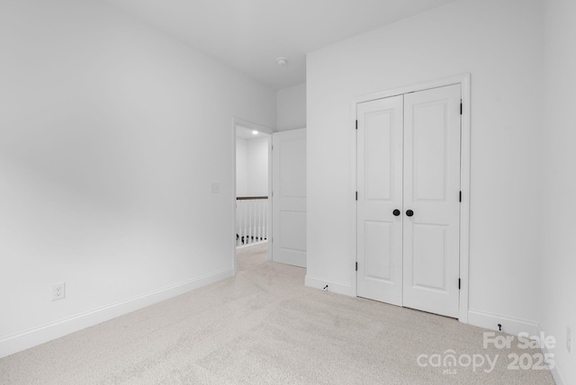 190 Cherry Springs Ln Unit 1-E, Asheville, NC 28804 - unfurnished bedroom featuring carpet flooring, baseboards, and a closet
