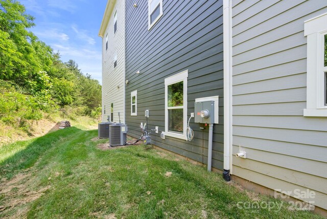 190 Cherry Springs Ln Unit 1-E, Asheville, NC 28804 - view of home's exterior featuring a lawn and central AC