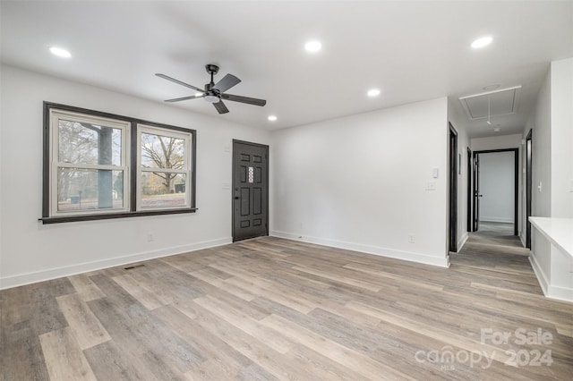 spare room with light hardwood / wood-style floors and ceiling fan