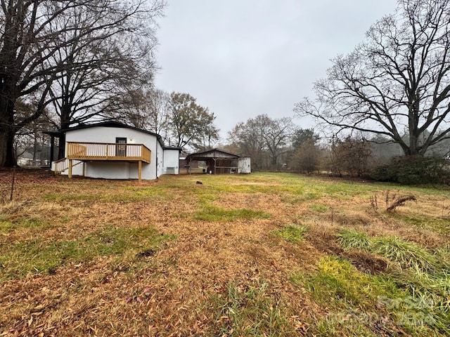 view of yard featuring a wooden deck