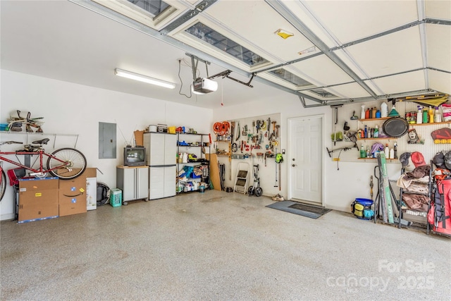 garage featuring a garage door opener and electric panel