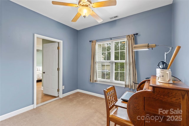 office space with ceiling fan and light colored carpet