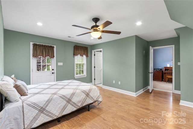 bedroom with ceiling fan and light hardwood / wood-style flooring