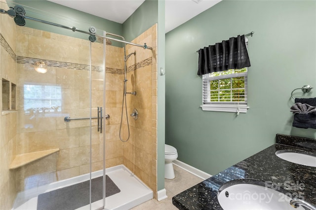 bathroom with vanity, a shower with shower door, and toilet