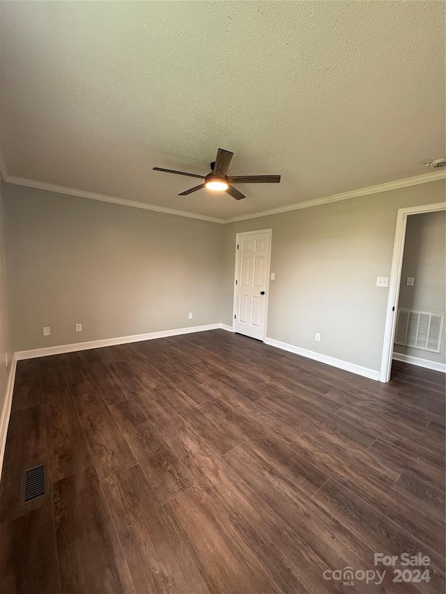 unfurnished room featuring dark hardwood / wood-style floors, ceiling fan, and a textured ceiling