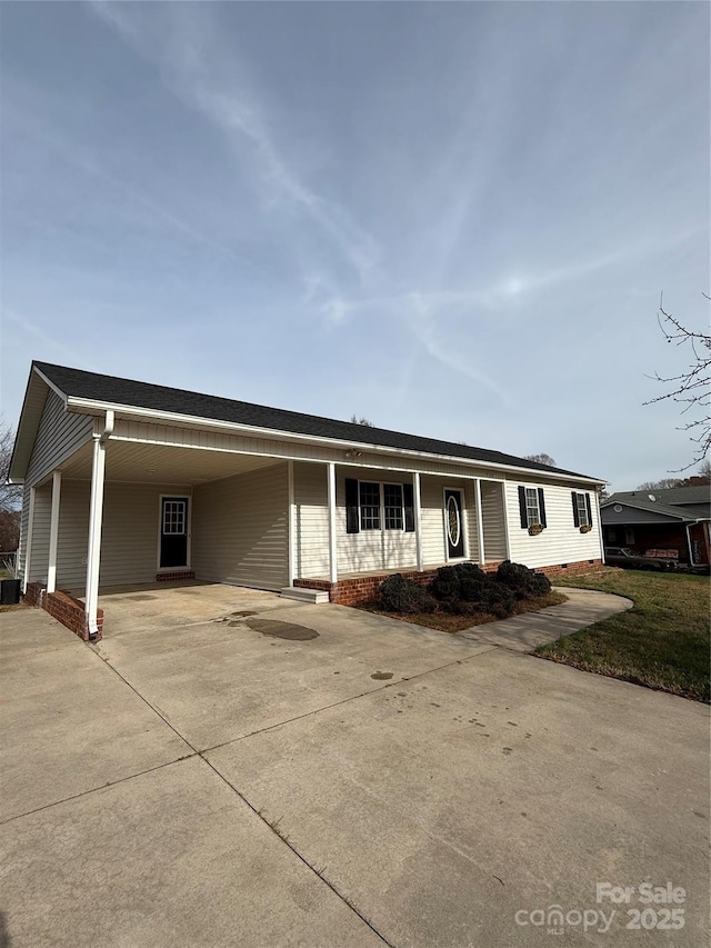 ranch-style house with a carport