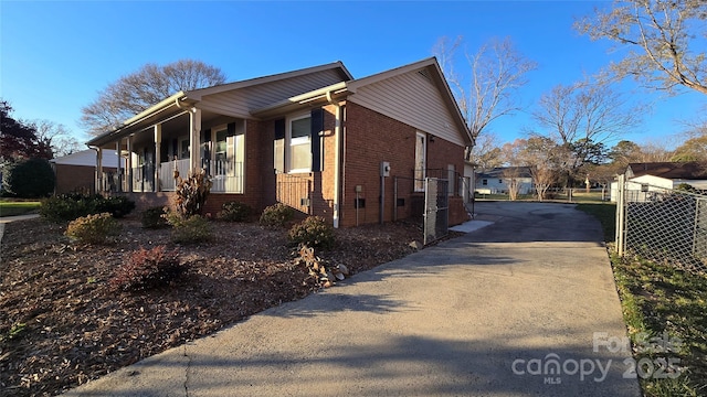 view of property exterior with a porch