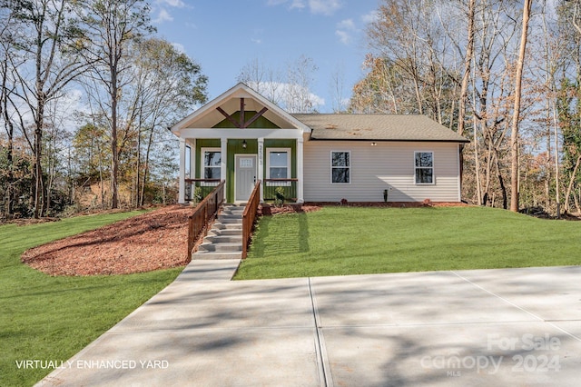 view of front of property with a porch and a front yard