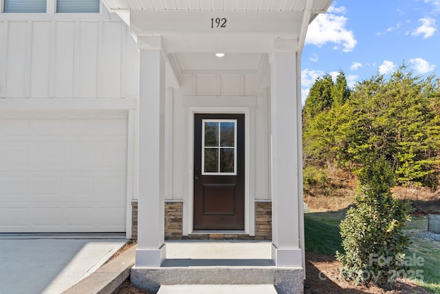 view of exterior entry featuring a garage