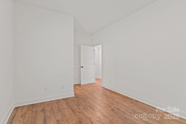 spare room with light hardwood / wood-style floors