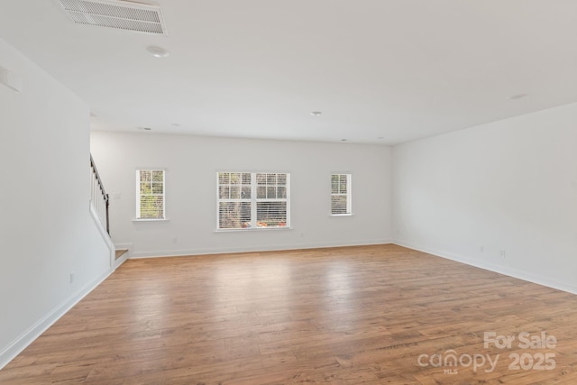 empty room with light wood-type flooring