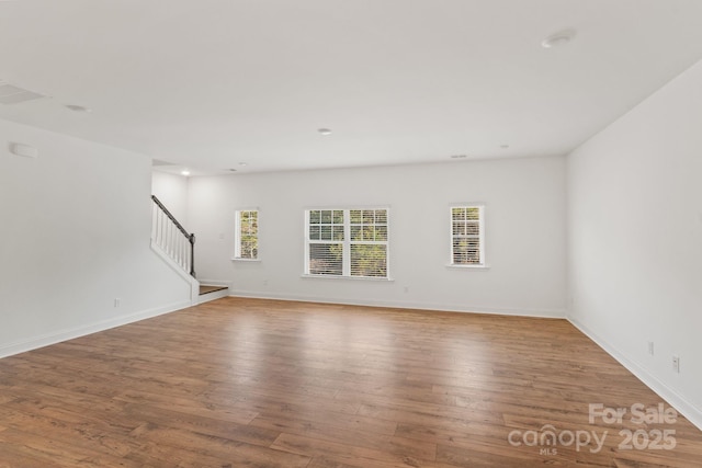 unfurnished living room featuring light wood-type flooring