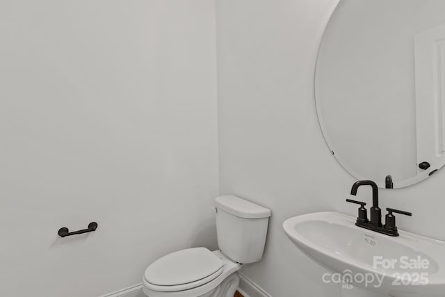 bathroom with toilet and sink