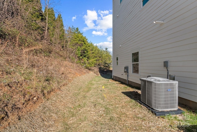 view of yard featuring central AC