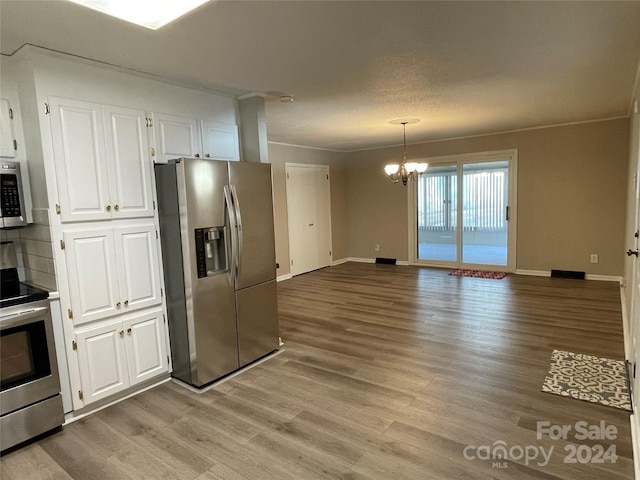 kitchen featuring light hardwood / wood-style floors, white cabinetry, and stainless steel appliances