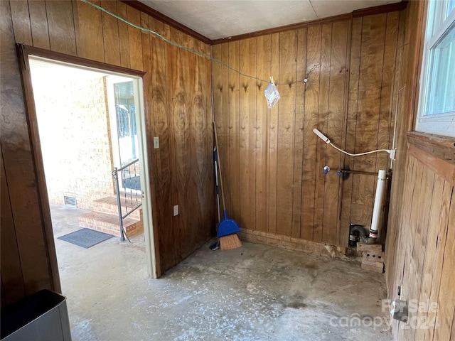 clothes washing area featuring wooden walls