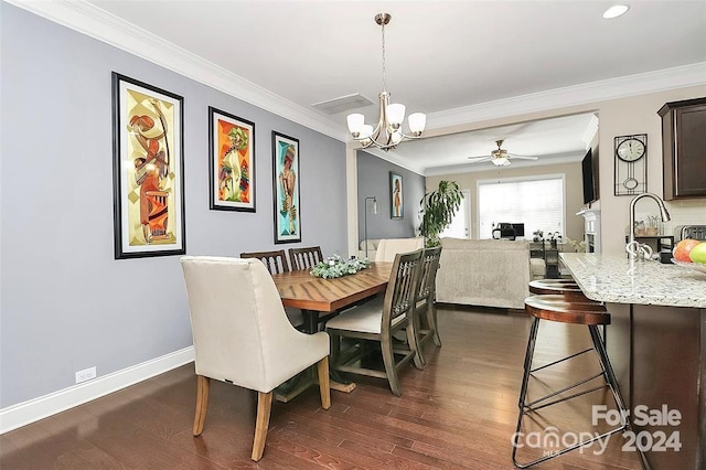 dining space with crown molding, dark hardwood / wood-style flooring, and ceiling fan with notable chandelier