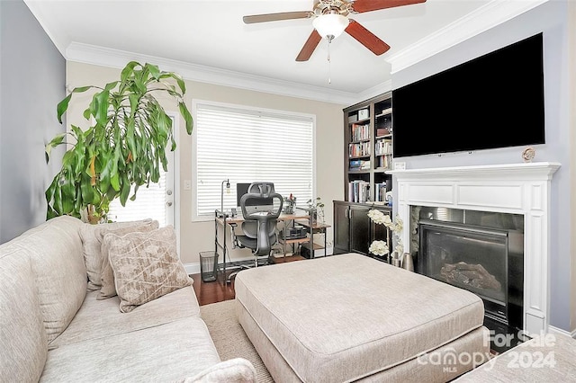 living room with ceiling fan, wood-type flooring, and ornamental molding