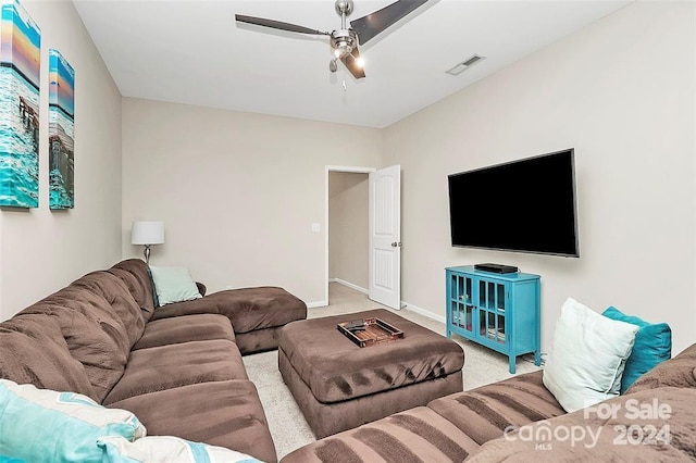 living room featuring ceiling fan and light colored carpet