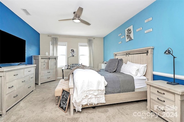 carpeted bedroom featuring ceiling fan